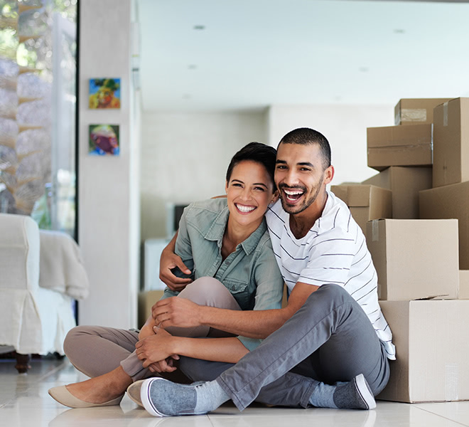 A young couple moving into their new home.