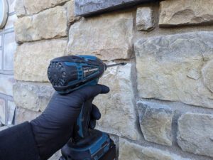 Driling probe holes in stone veneer